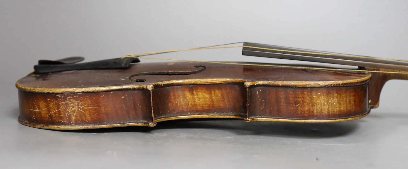 A cased German violin, labelled Stradivarius and dated 1886, back measures 36cm excl button